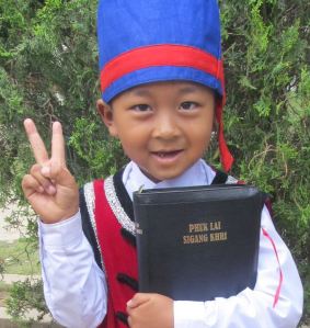 A Myanmar child holding the Bible. 